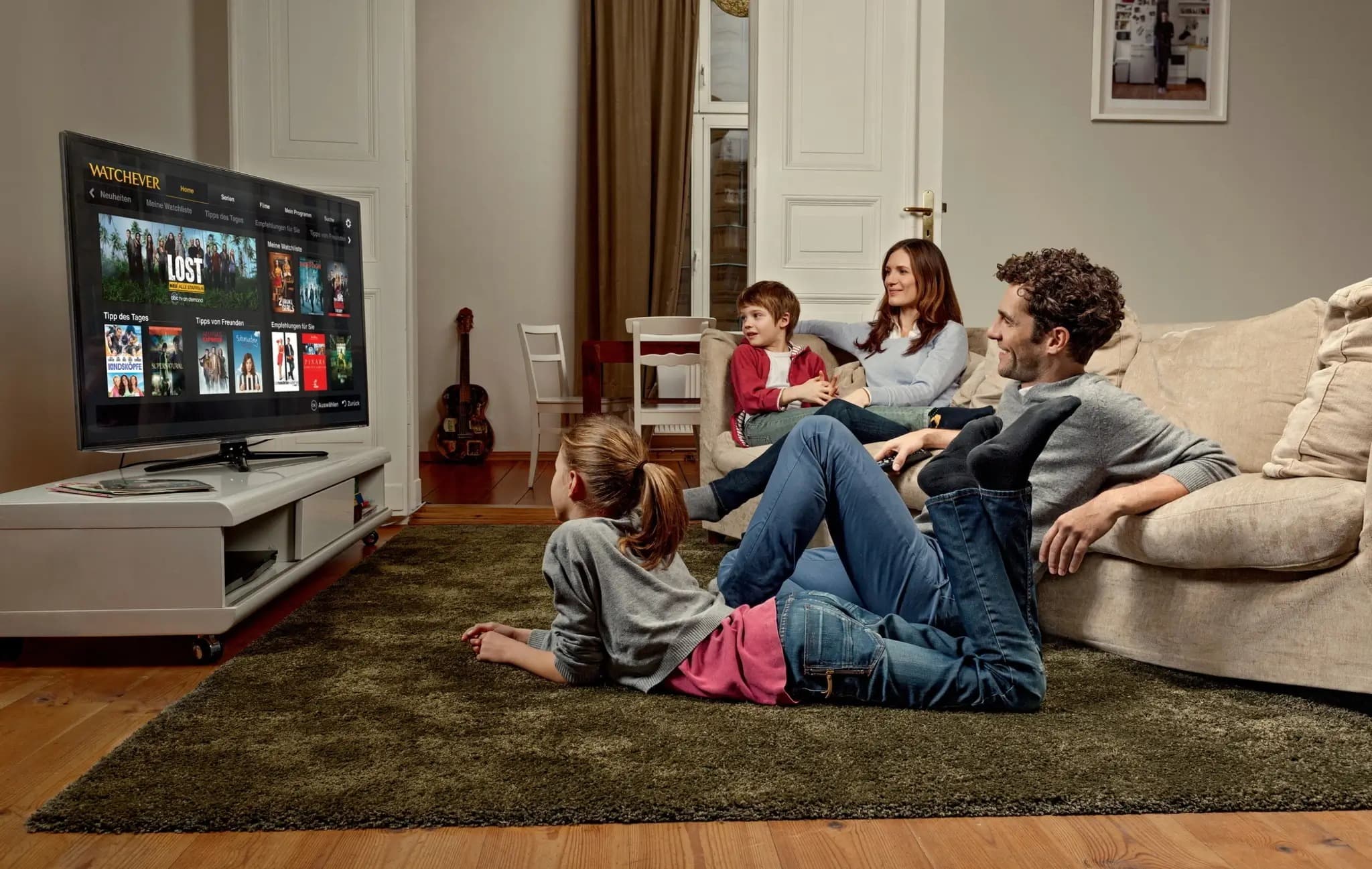 Family watching IPTV channels in a living room